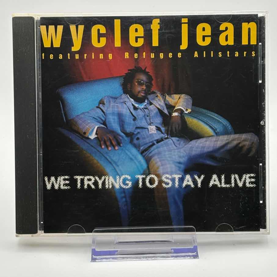 Wyclef-Jean-Featuring-Refugee-Allstars--We-Trying-To-Stay-Alive-Used-CD