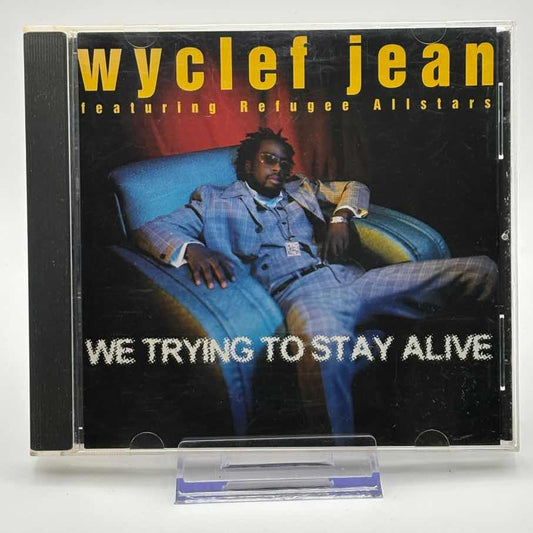 Wyclef-Jean-Featuring-Refugee-Allstars--We-Trying-To-Stay-Alive-Used-CD